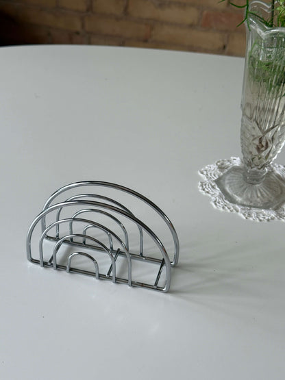 Servietholder i sølvfarvet metal